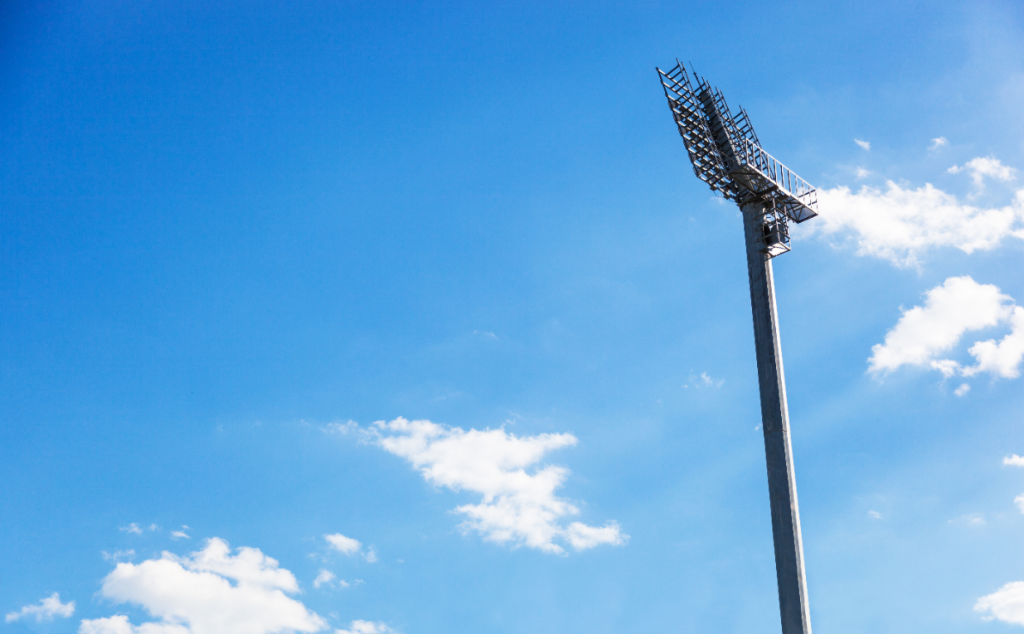 spotlight-on-lighting-tower-of-stadium-on-blue-skye-background