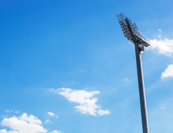 spotlight-on-lighting-tower-of-stadium-on-blue-skye-background